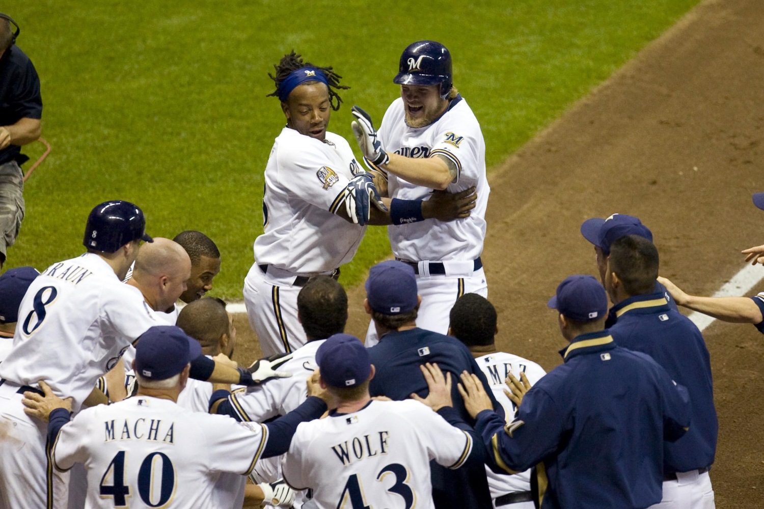 Milwaukee Brewers' Lorenzo Cain and Orlando Arcia smile during the