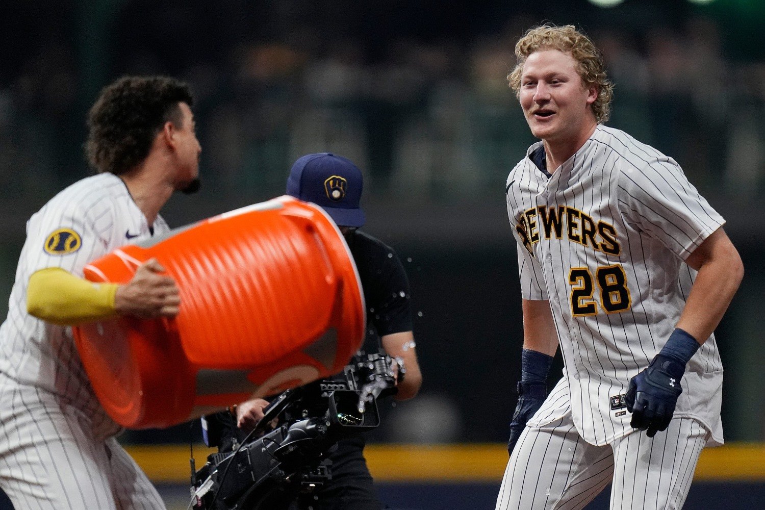 Milwaukee Brewers' Garrett Mitchell reacts after hitting a double